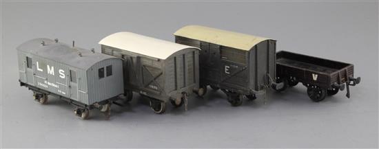 A N.E. cattle wagon, no.153516, in grey, an LMS fish van 10T, no.11170, in grey, a T.V. flat wagon, no.90, in brown,